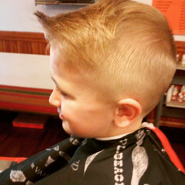 A young customer with a fresh cut