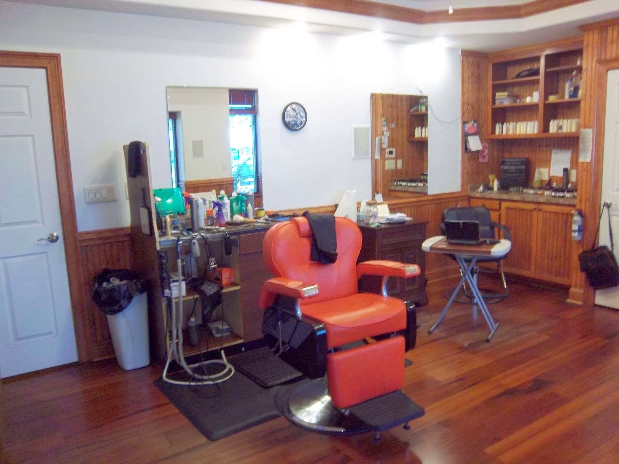 A red barber chair by the window